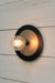Large black with small metal disc wall light