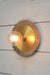 Large metal with small brass disc wall light