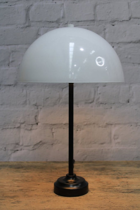 Table lamp with white dome shade and black base