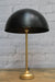 Table lamp with black dome shade and gold/brass base