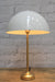Table lamp with white dome shade and gold/brass base