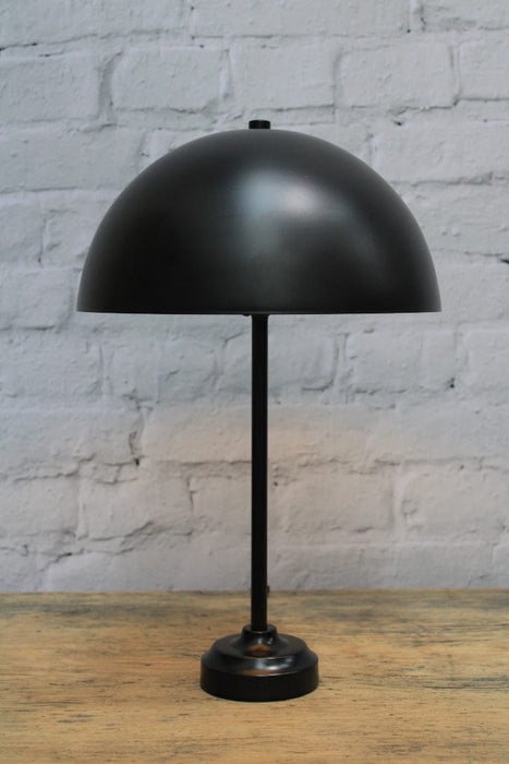 Table lamp with black dome shade and black base