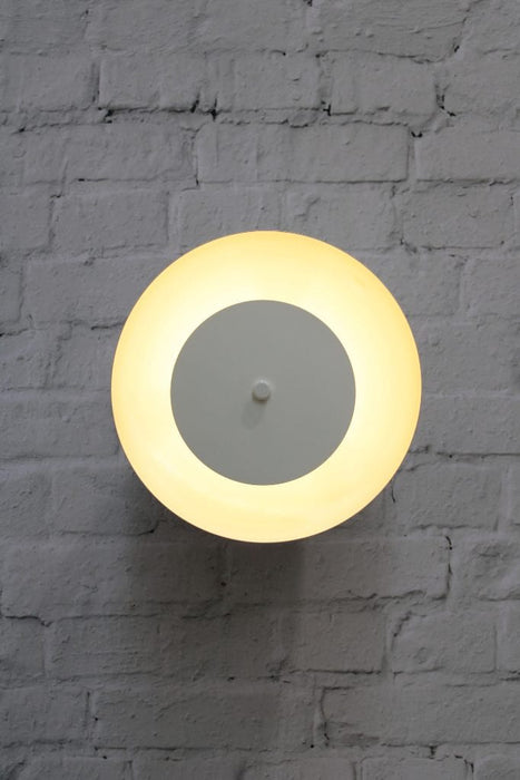 Dome wall light with white shade and white disc