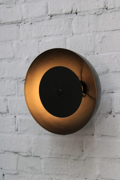 Dome wall light with black shade and black disc