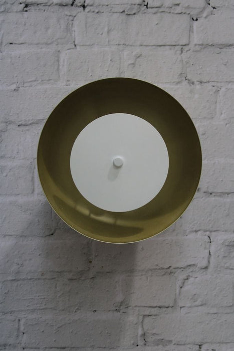 Dome wall light with gold/brass shade and white disc