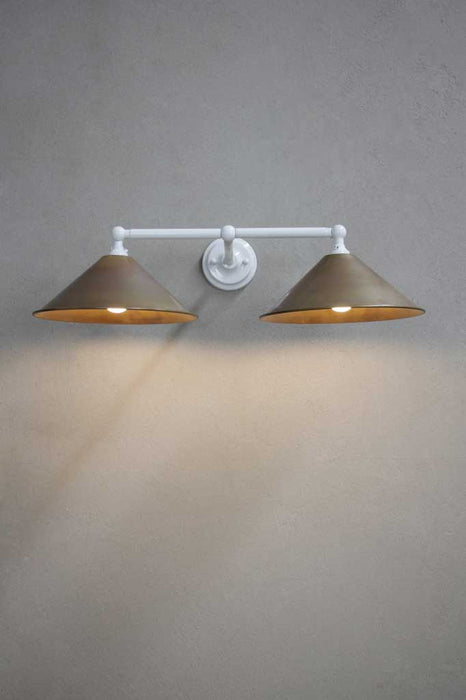 White double arm sconce with aged brass shades