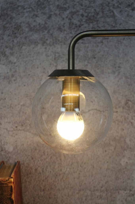 Exposed bulb style table lamp with minimalist industrial vintage design