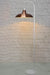 white floor lamp with suspended copper finish shade