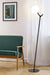 Steel floor lamp with black finish and opal glass shade in room