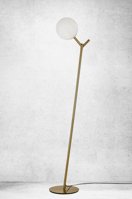 Steel floor lamp with antique gold finish and opal glass shade