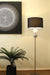 Tribeca Floor Lamp in pewter switched on and place next to art work. 