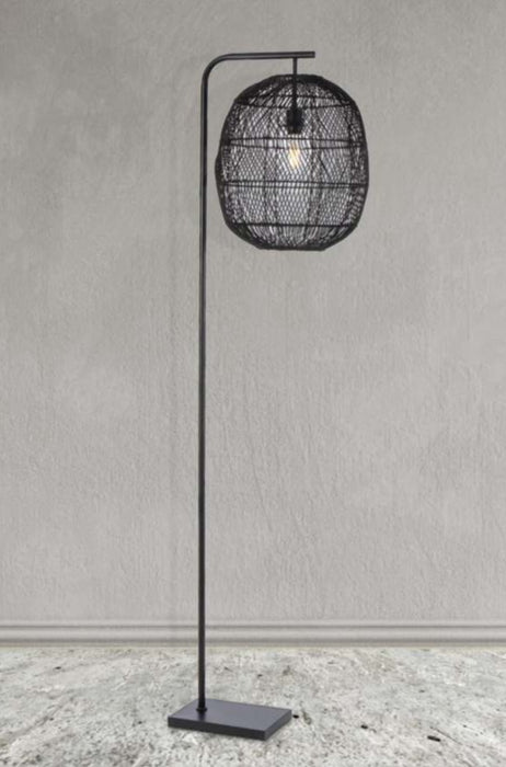 Rattan floor lamp in black finish against grey background. 