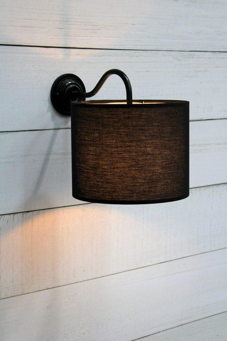 Fabric wall light with black brass sconce