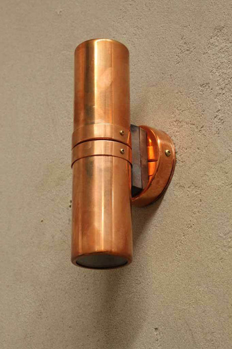 Facade lighting for homes. polished copper wall lighting. ip54 rated spotlights