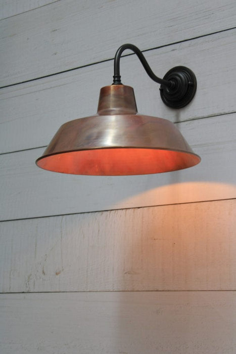 Factory wall light with matt black brass gooseneck sconce and aged copper shade