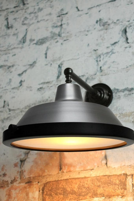 Flat glass cover on vintage steel wall lamp