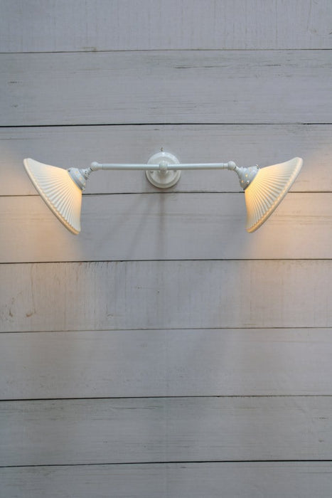 Double arm wall light with white finish and ceramic shades