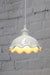 Frilled ceramic pendant with white cord