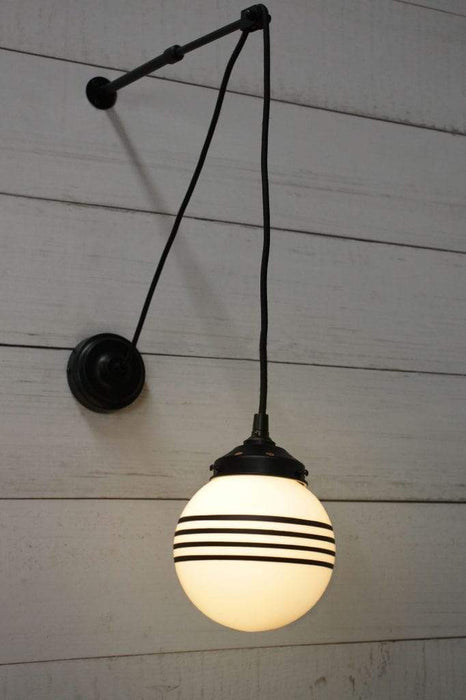 Glass pulley wall light with four stripe shade