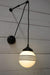 Glass pulley wall light with four stripe shade