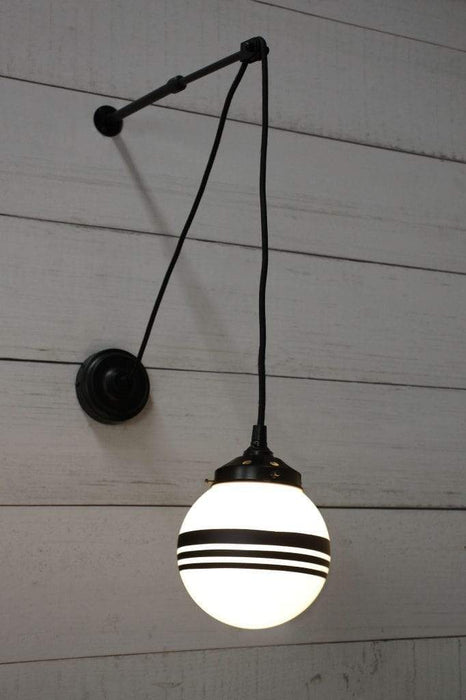 Glass pulley wall light with three stripe shade