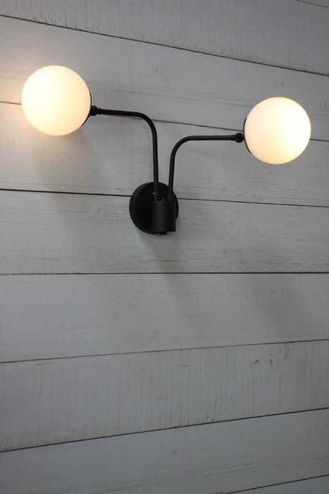 Glass wall light with adjustable lampholders