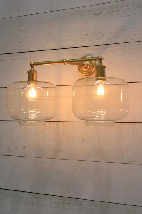 Gold wall light with square round shades
