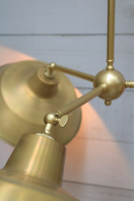 Gold/Brass steel frame wingnut close up with bright brass shade in tilted position