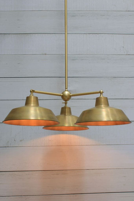 Factory industrial chandelier in gold/brass steel with bright solid brass shade