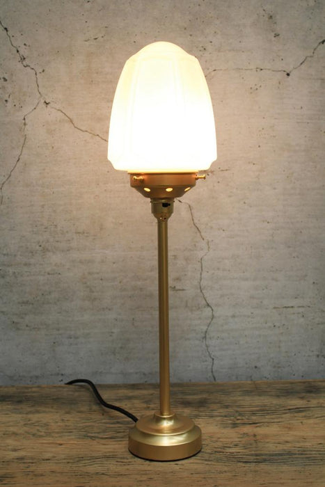 Table lamp with gold brass base and gallery