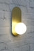 Gold wall light upright position