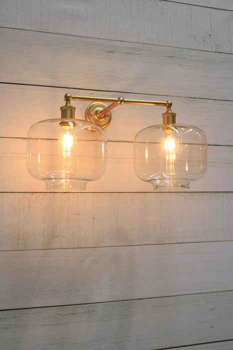 Gold wall light with vintage bulb