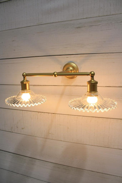 Gold wall light with scalloped glass shades