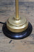 gold table lamp on a black mounting block