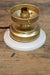 white table mounting block with a gold lamp base