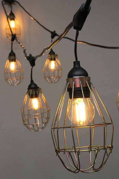 Hanging string lights with cages. yellow nickel cage lights. buy party lights online.