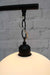 chain suspension holding up glass shade