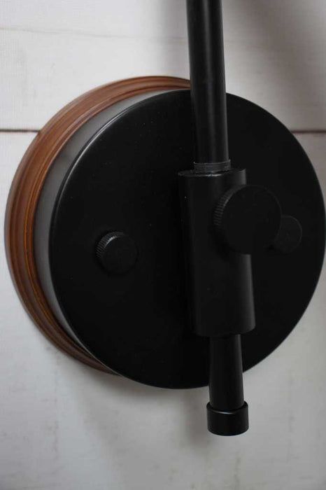 swivel arm wall mount on a wooden mounting block