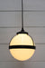 Huxley pendant with black cord and medium opal shade
