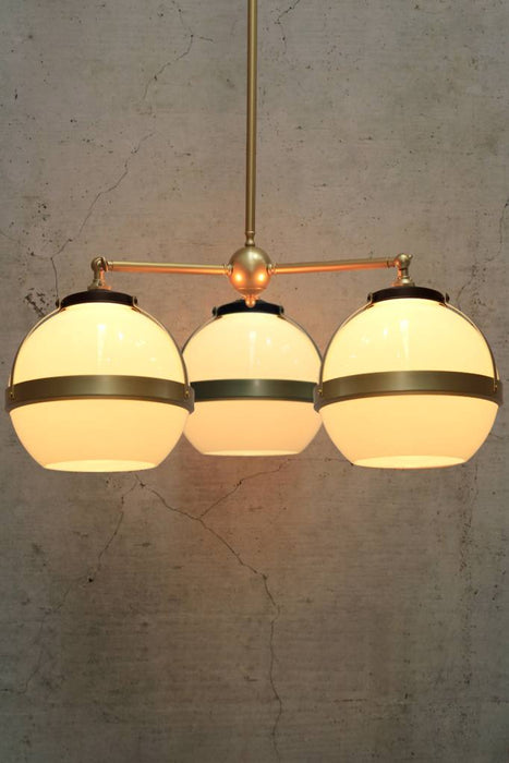 Huxley chandelier in gold with medium open shades