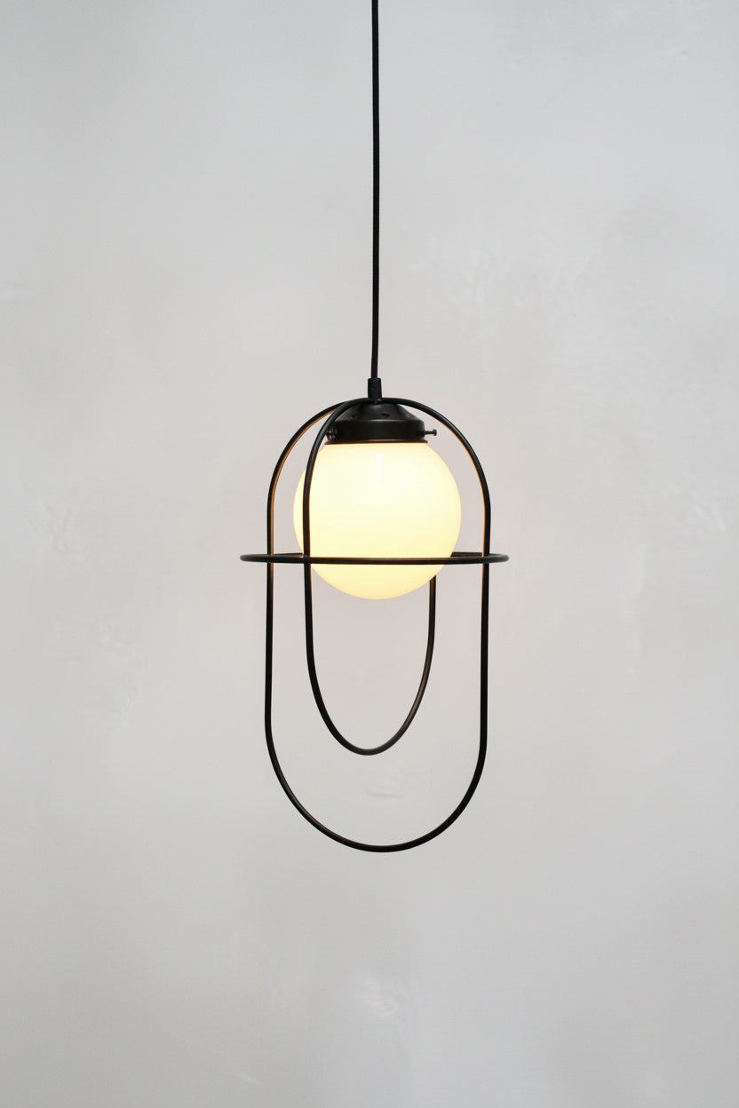 Pendant light with opal glass shade and matt black metalware