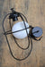 Disassembled pendant light with opal glass shade and matt black metalware