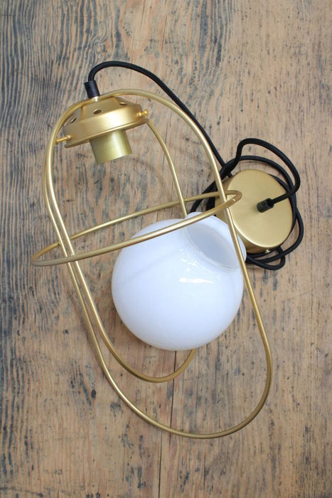 Disassembled pendant light with opal glass shade and gold/brass metalware