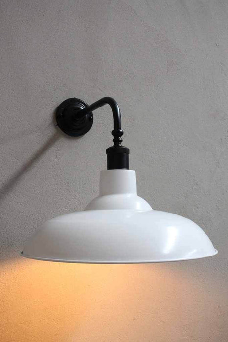 white shade with black wall sconce