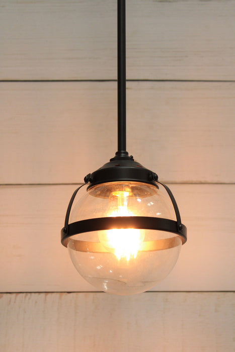 Huxley glass pendant with black pole fixture and small clear shade