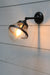 small clear shade wall light in black