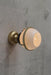 Huxley ceiling light on wall in gold finish with open shade