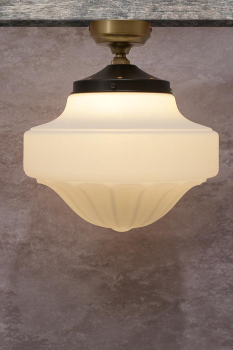 Large milky glass shade with gold/brass batten holder.