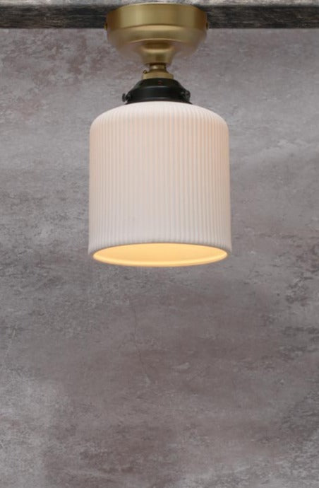 Ceramic flush mount light with gold/brass batten holder