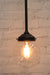 Junction light with C configuration and clear glass ball shade